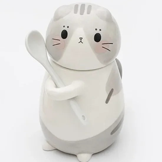 Kattmugg i keramik med sked och lock