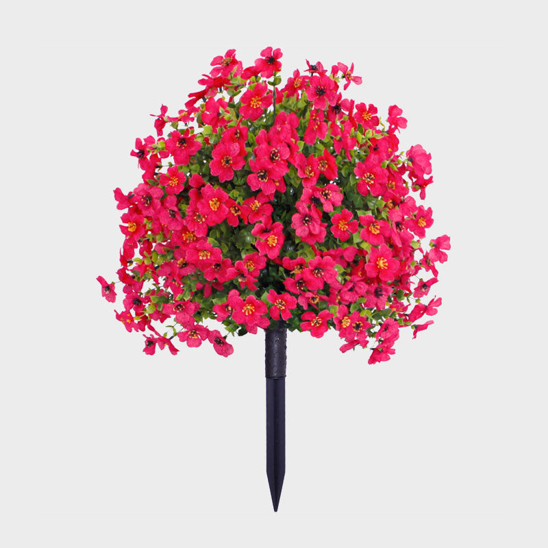 Blomsterarrangemang med konstgjord eukalyptus och violer