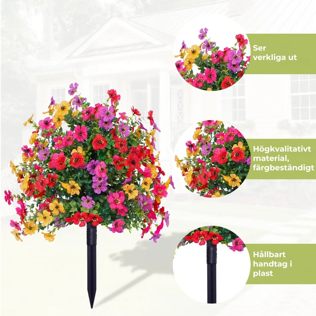 Blomsterarrangemang med konstgjord eukalyptus och violer